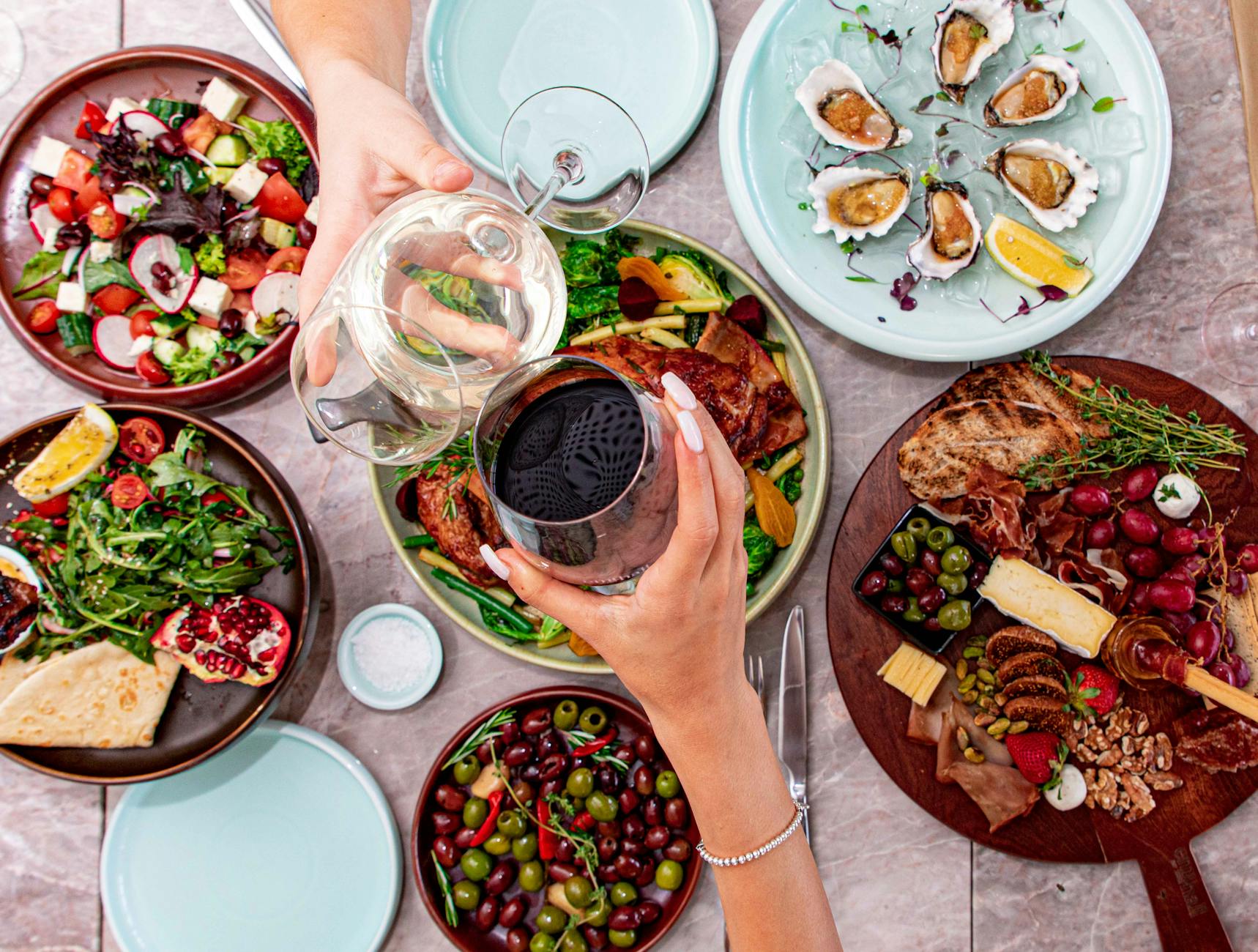 a person holding a glass of red wine Elevate Your Escape: Plan a Luxury Travel Experience