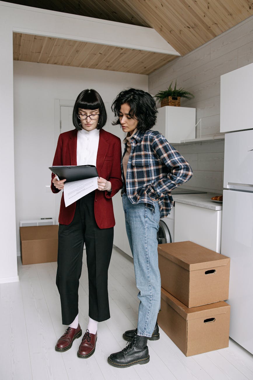 woman talking with real estate agent Selling a House Fast Doesn’t Have to Be Stressful