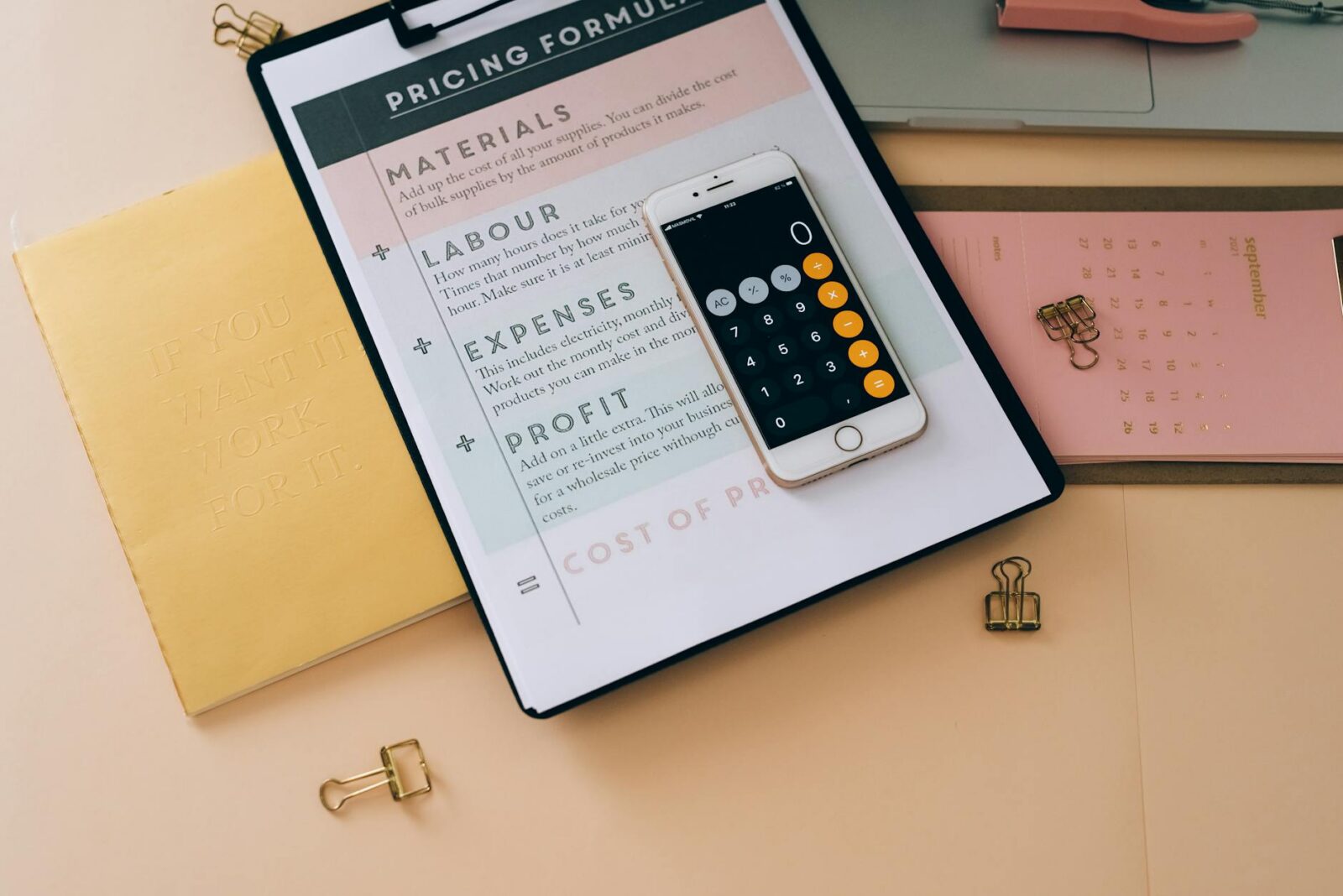 white mobile phone on black clipboard with white paper How to Make Your Small Business Stand Out In a Crowded Marketplace
