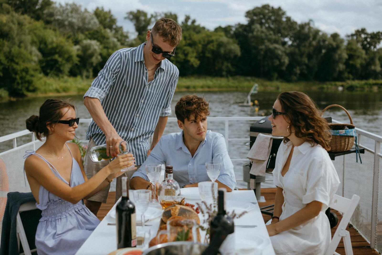 man in blue and white stripe button up shirt sitting beside woman in white shirt Elevate Your Escape: Plan a Luxury Travel Experience