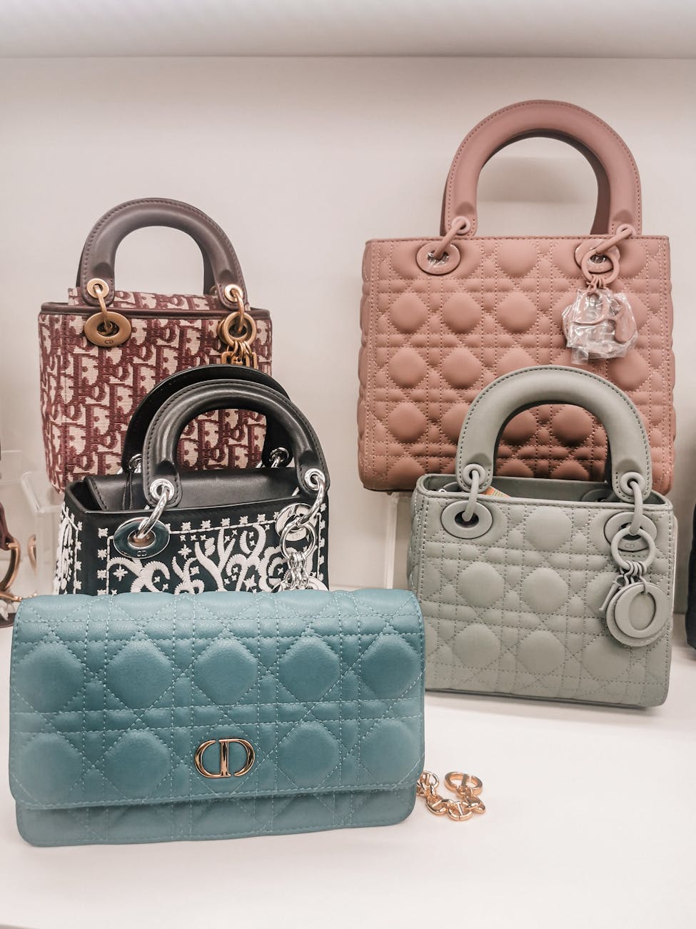 elegant leather handbags on a white surface How to Protect Your Luxury Assets from Life’s Little Surprises