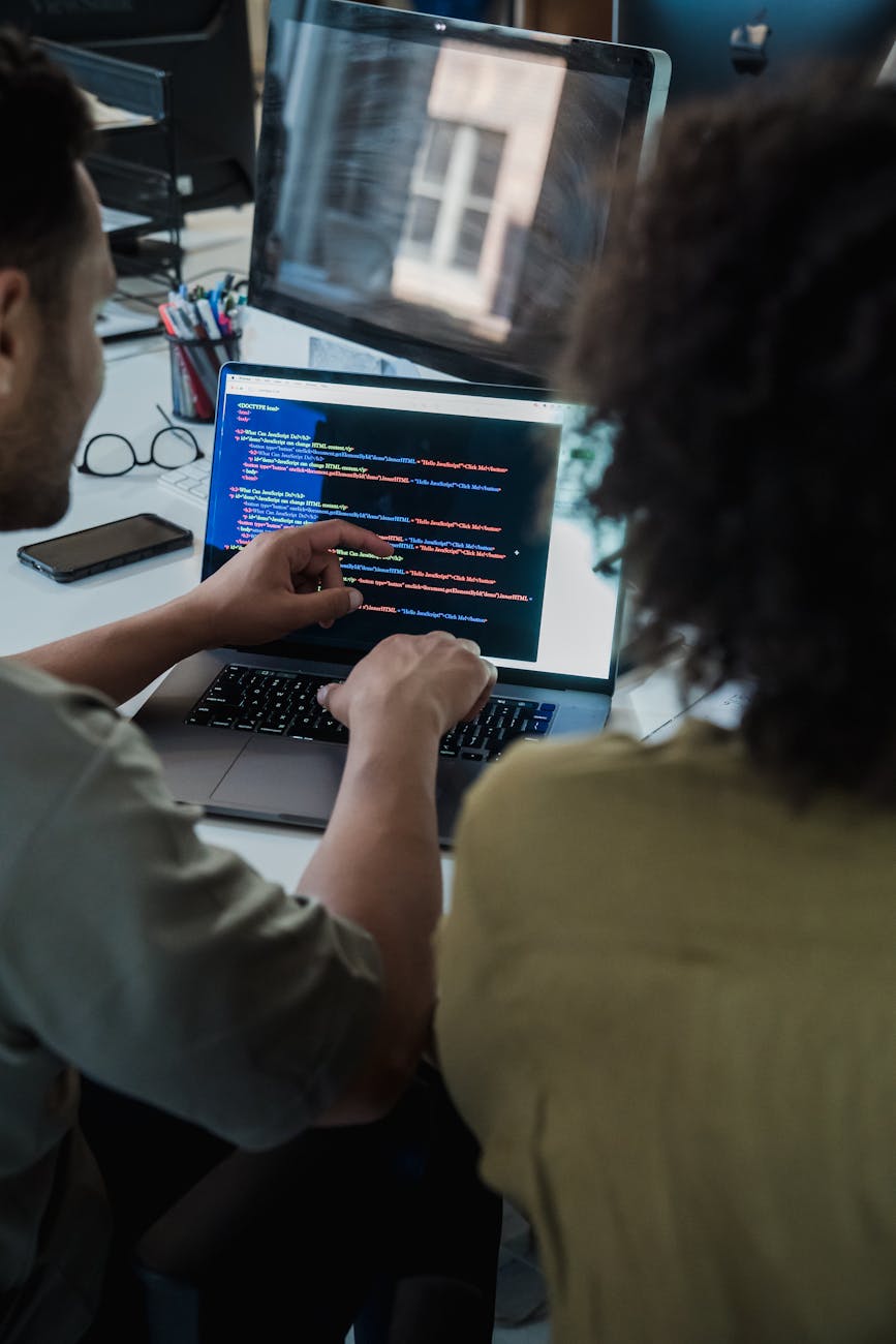 programming on laptop Tech Troubles Slowing Your Business Down? Here’s 8 Ways to Fix Them