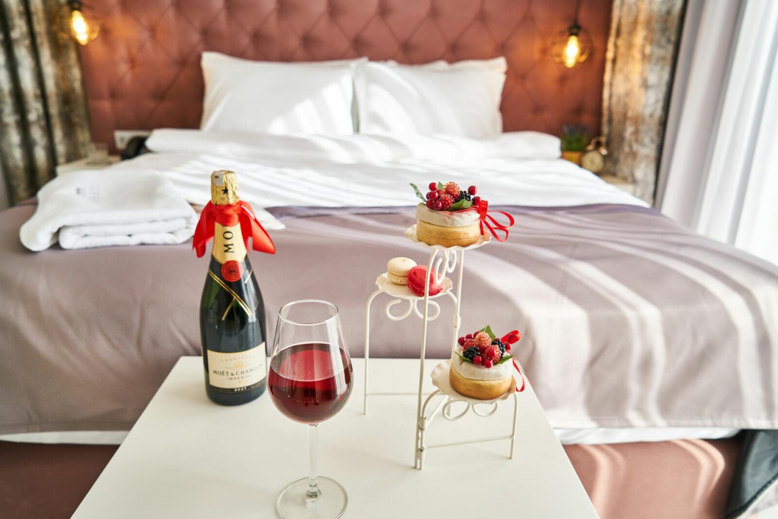 photo of wine bottle and food on table How to Increase Hotel Revenue: 3 Practical Tips for Sustainable Growth