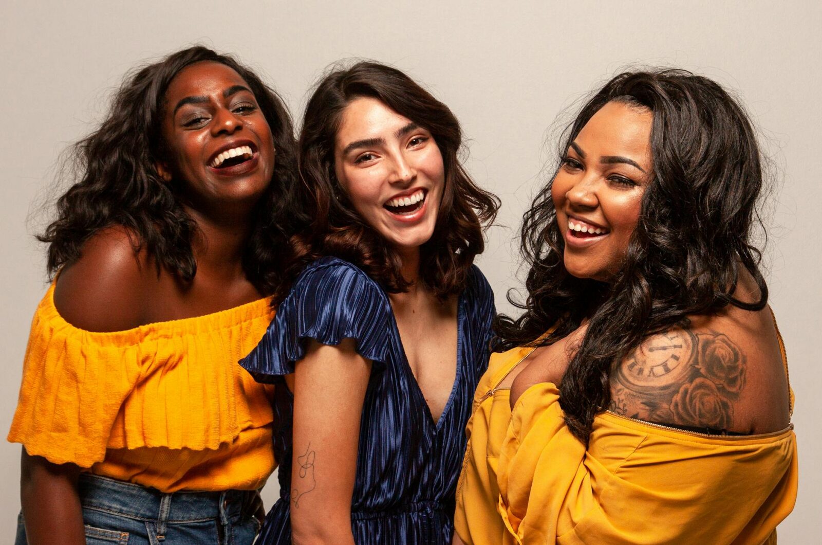 three women smiling The Hidden Struggle of High-Achieving Women: Mental Burnout