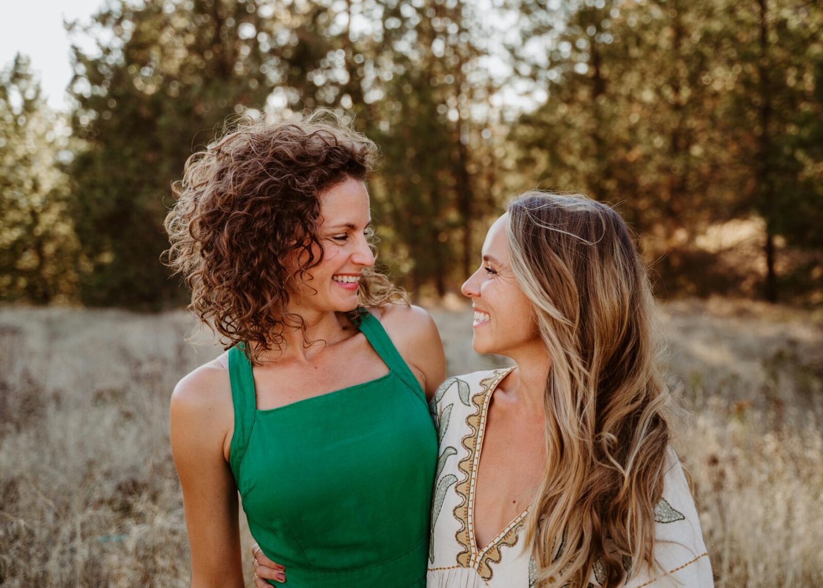 joyful friends embracing in sunlit meadow Rediscover Yourself: 10 Gentle Ways to Reconnect with Who You Are