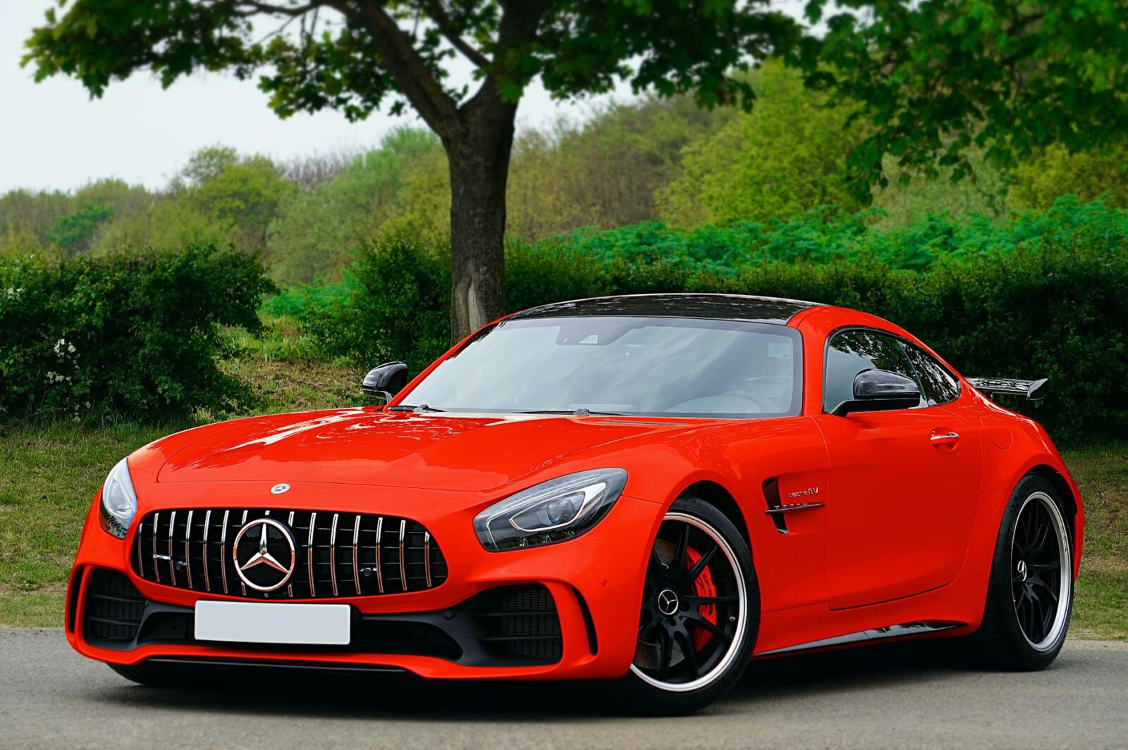 photo of red car parked How to Protect Your Luxury Assets from Life’s Little Surprises