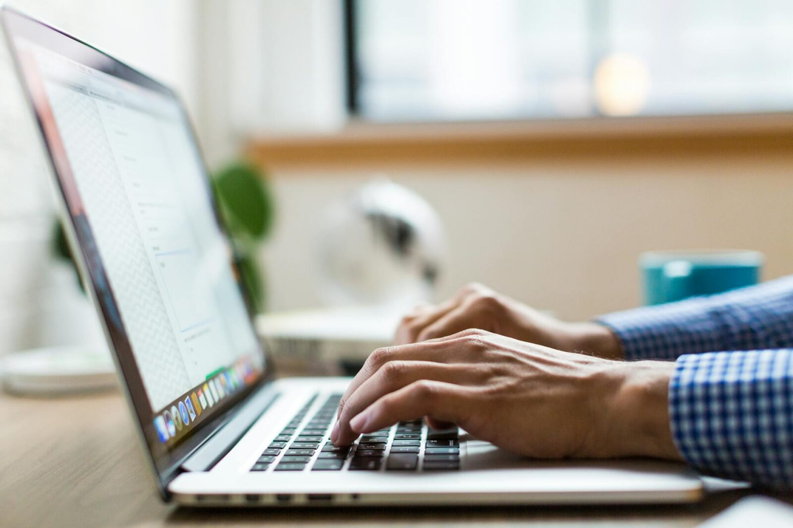 person using macbook Tech Troubles Slowing Your Business Down? Here’s 8 Ways to Fix Them