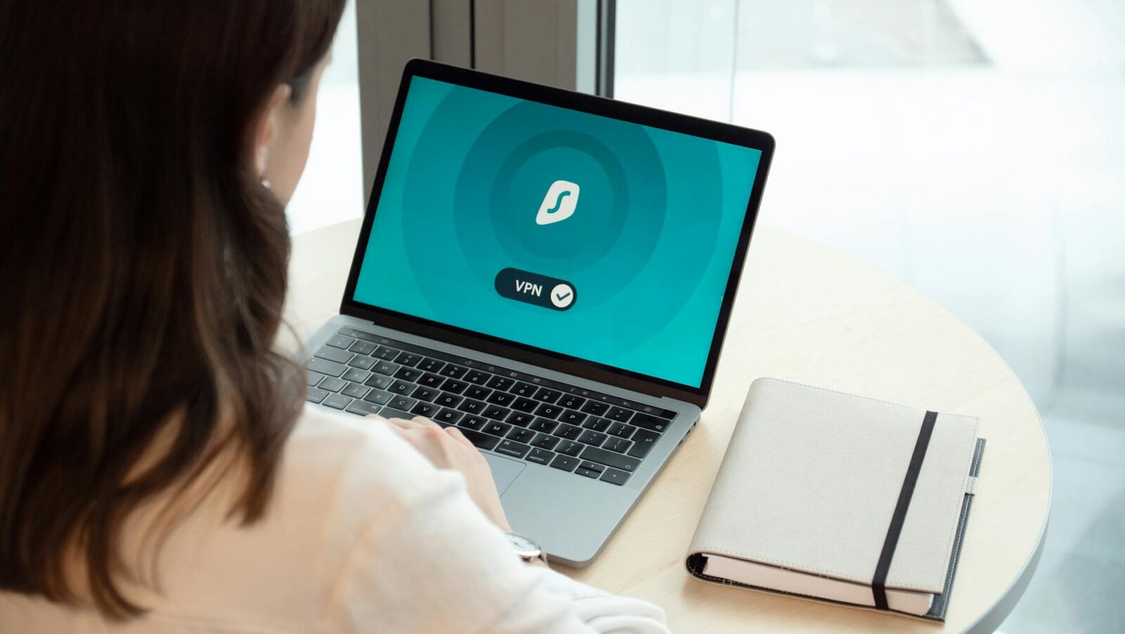 woman using macbook pro Tech Troubles Slowing Your Business Down? Here’s 8 Ways to Fix Them