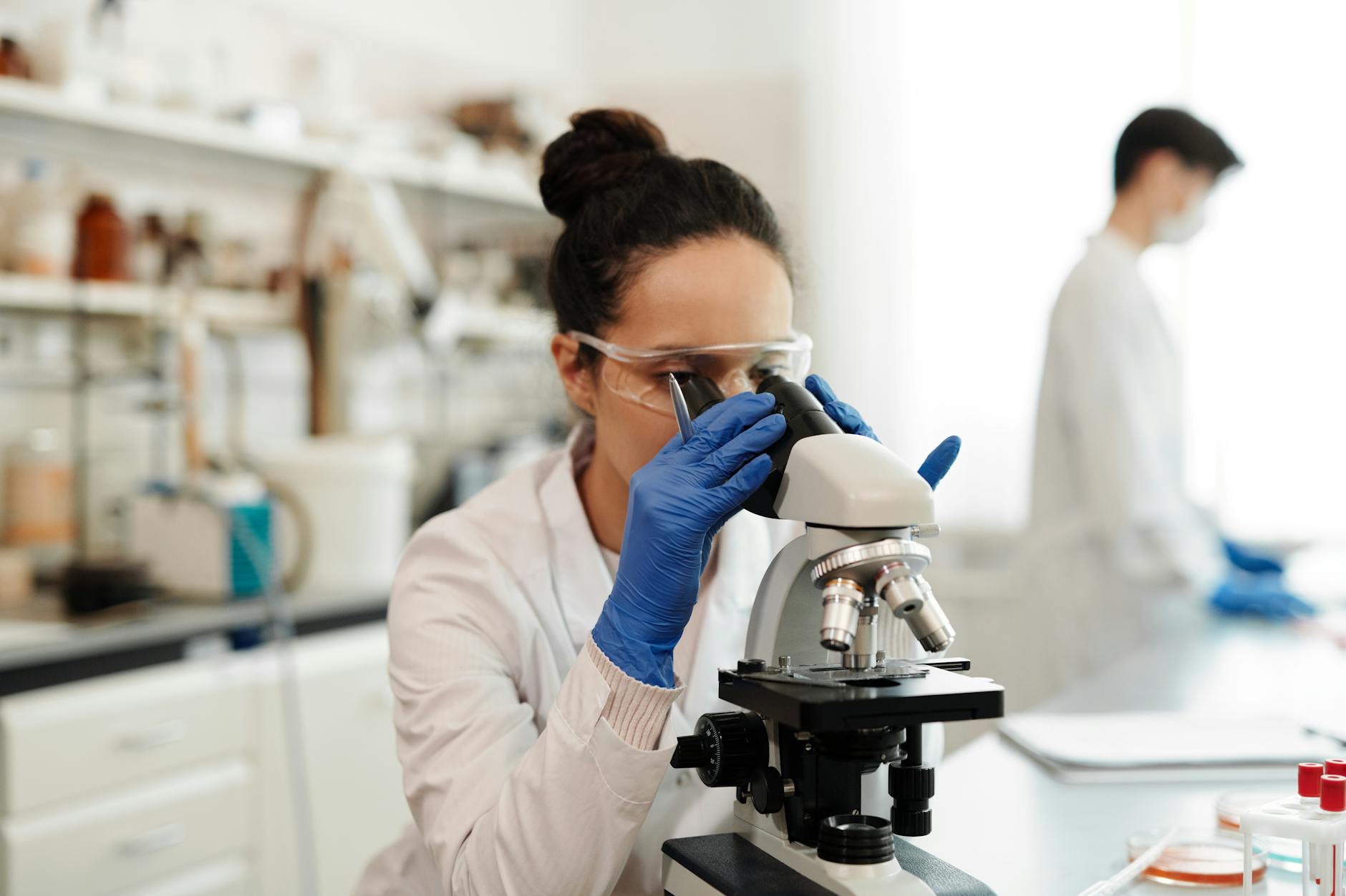 a woman using microscope Self-Diagnosis Dos and Don’ts: How to Use the Internet to Your Advantage