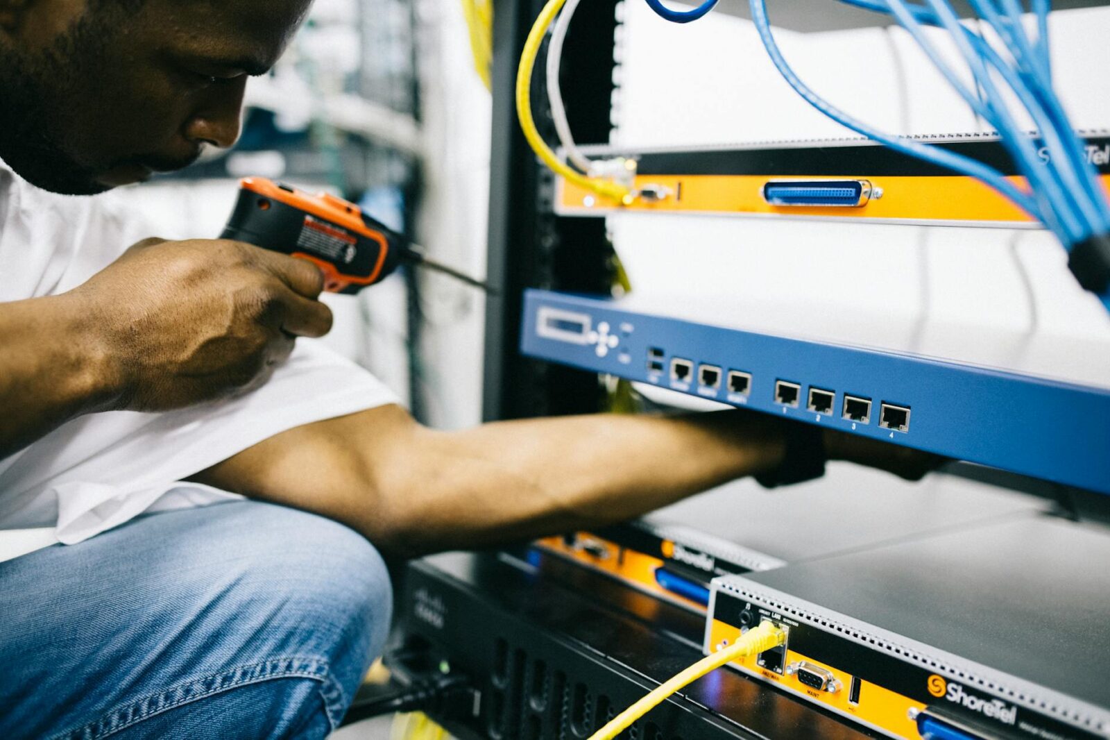 professional crop black technician working with hardware Tech Troubles Slowing Your Business Down? Here’s 8 Ways to Fix Them