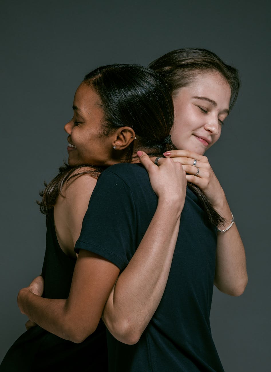 happy women hugging Calming Techniques for When Your Thoughts Feel Out of Control