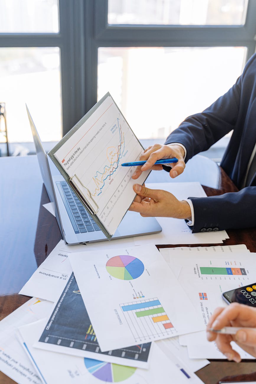 person in black suit jacket holding white paper Financial Safety Nets When Life Throws Curveballs
