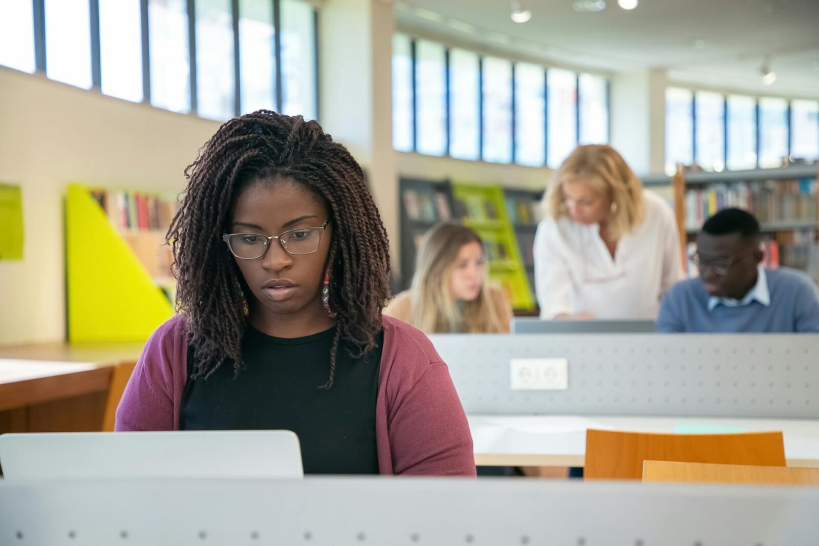 focused multiracial students doing presentation in library with teacher Self-Diagnosis Dos and Don’ts: How to Use the Internet to Your Advantage