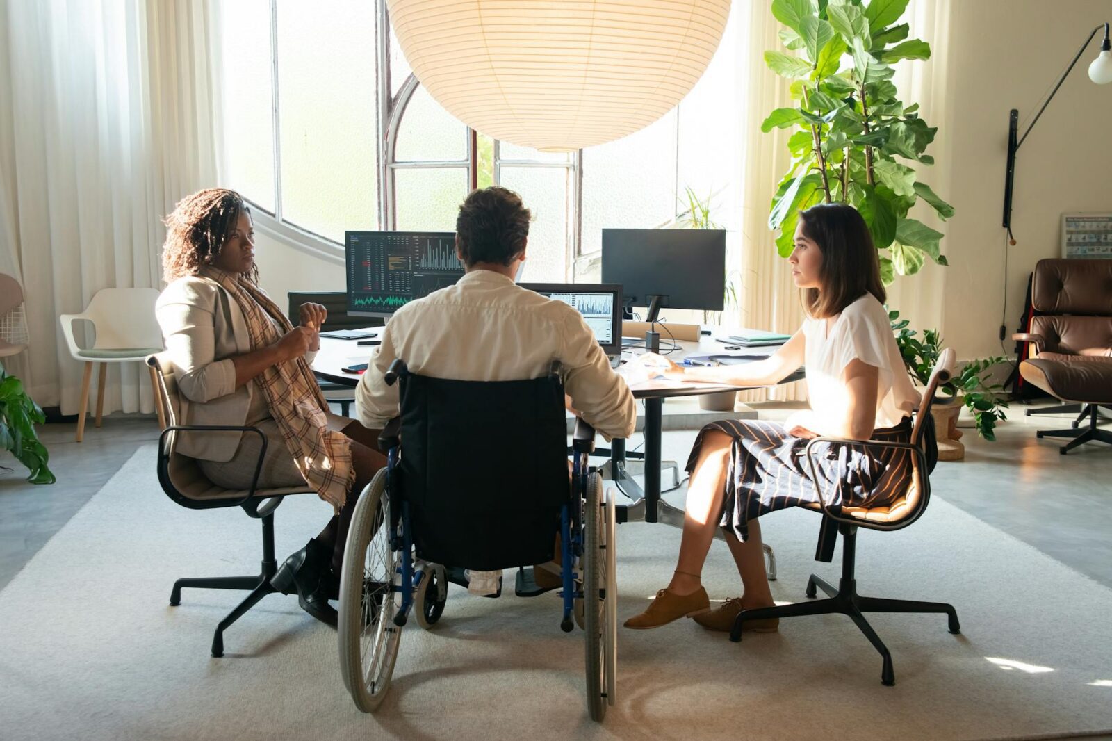 a group of people having a meeting in the office 10 Ways to Make Clients Feel Comfortable in Your Office