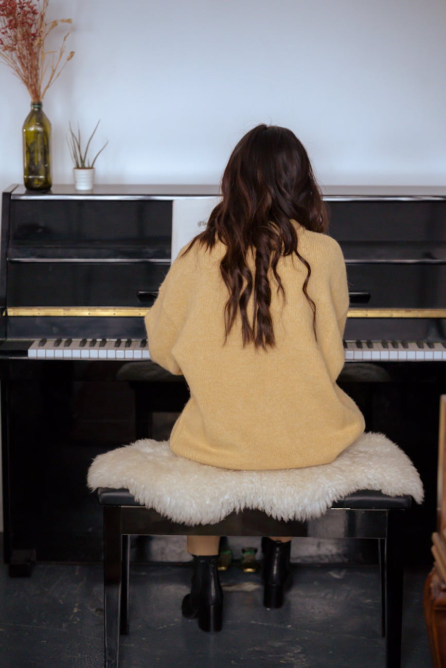 female musician playing piano during rehearsal Beyond Moving Boxes: Extra Services Moving Companies Offer