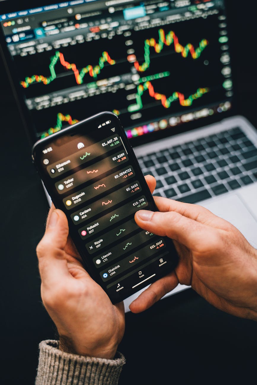 person holding a smartphone What Would You Do With $100,000? Tips From a Pro Investor Dividend Stocks and Stock Market Investing