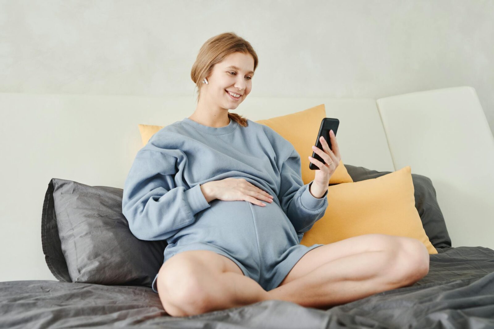 a woman sitting on the bed Self-Diagnosis Dos and Don’ts: How to Use the Internet to Your Advantage