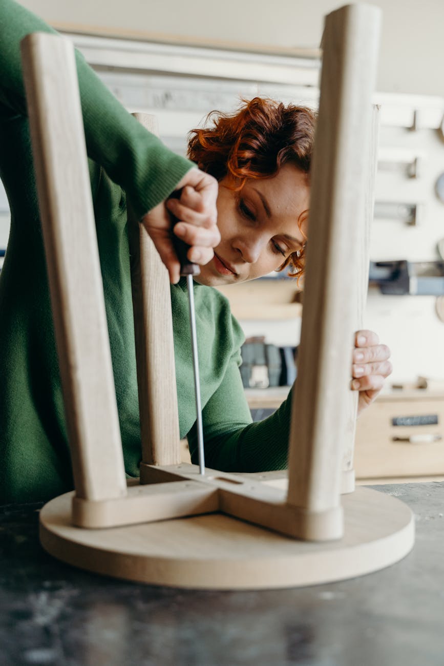 a woman making a wooden chair Beyond Moving Boxes: Extra Services Moving Companies Offer