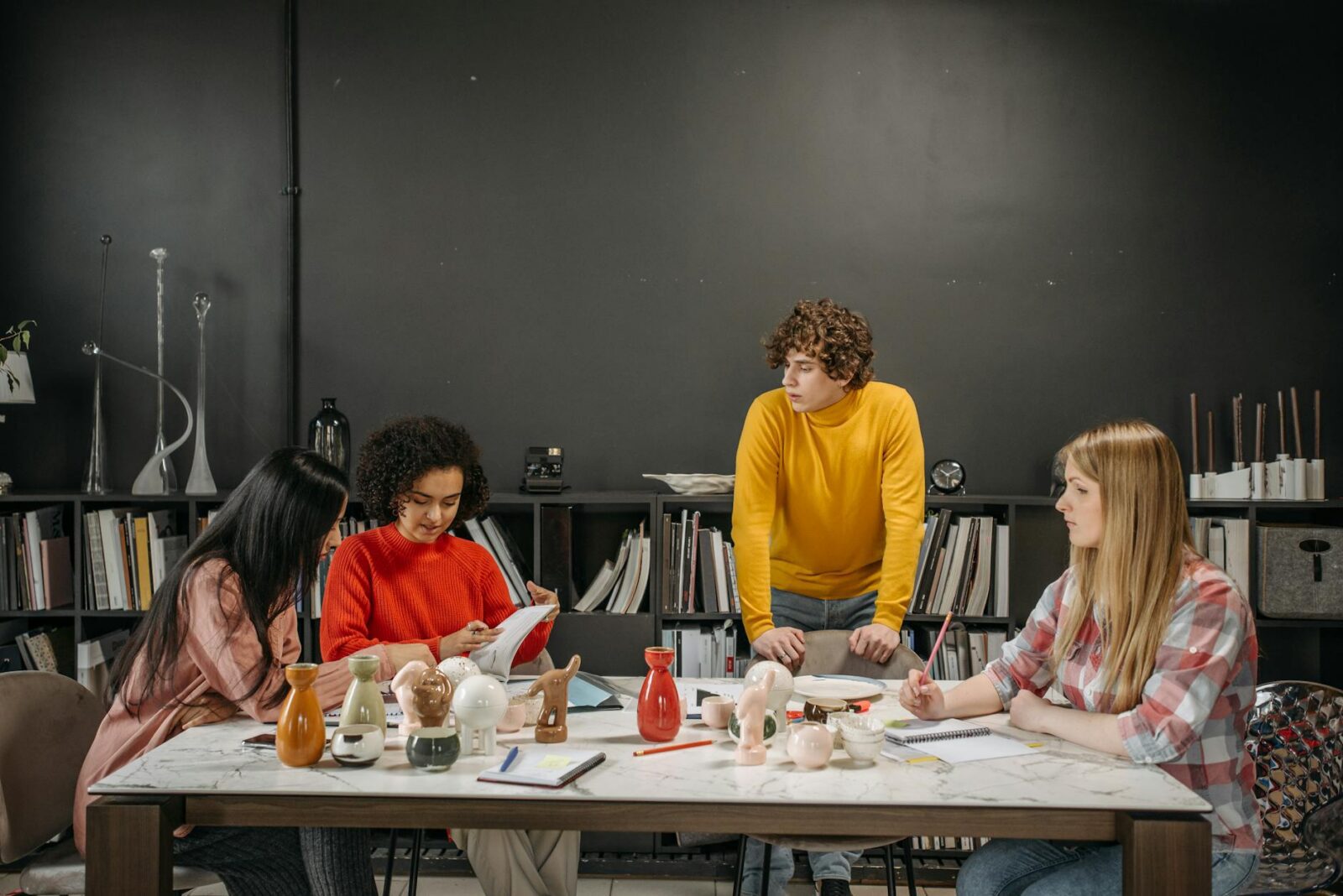 young businesspeople having a business meeting What Goes Into Product Design? 6 Key Steps to Create a Successful Product