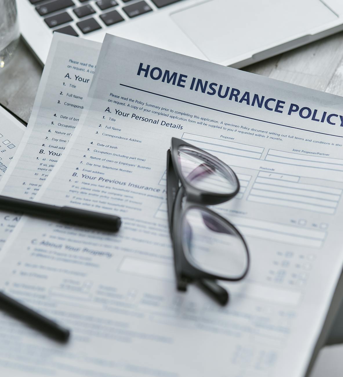 black framed eyeglasses on white paper Financial Safety Nets When Life Throws Curveballs