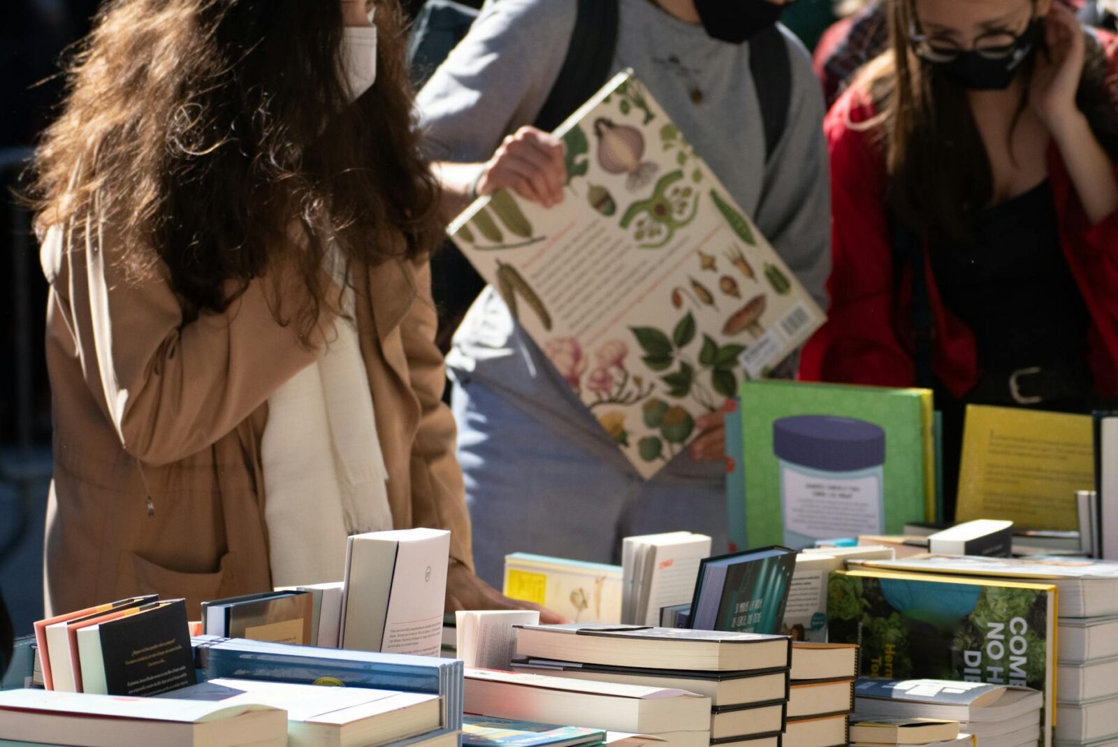 people looking at books 10 Steps to Build a Successful Writing Business