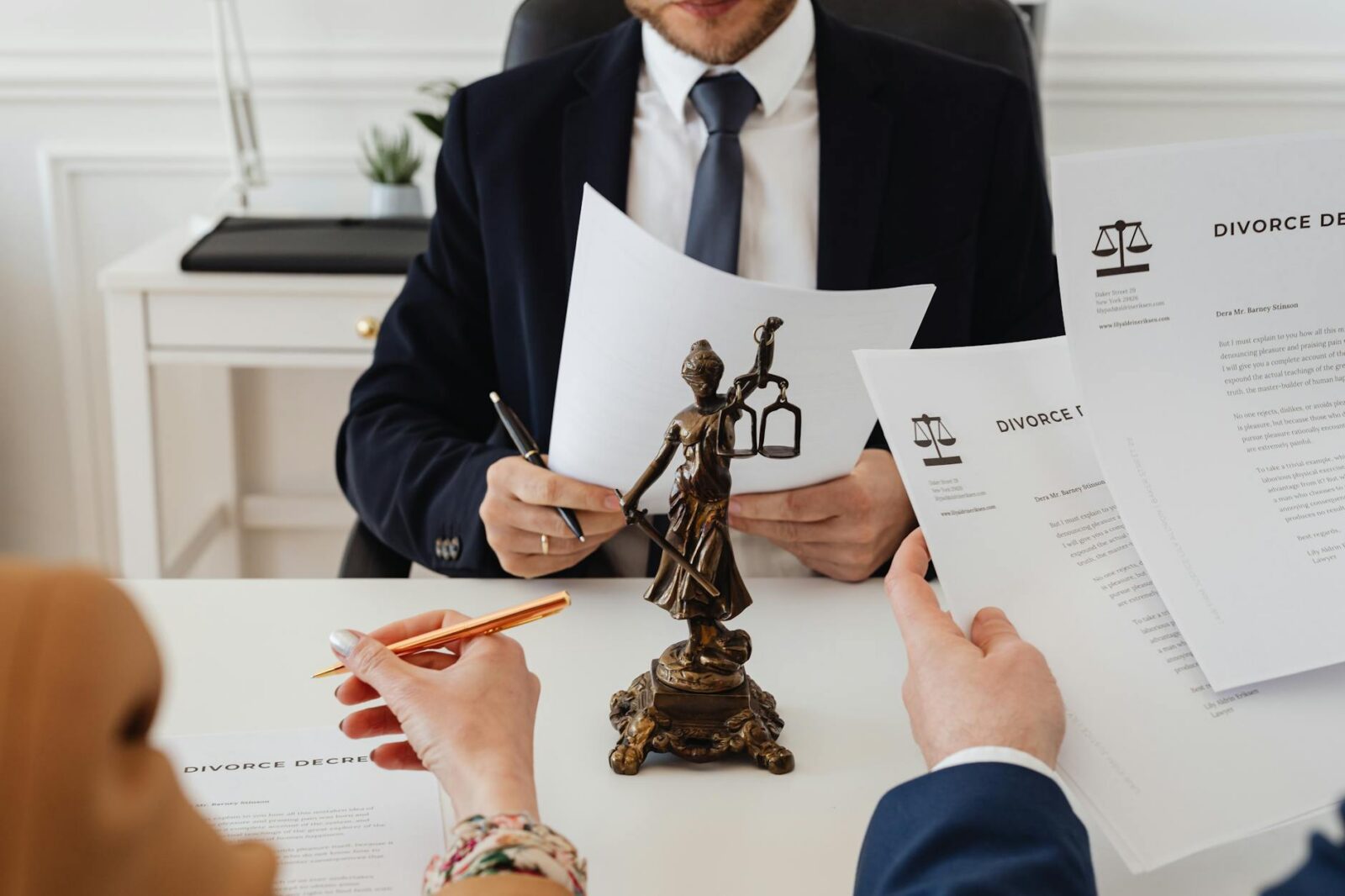 lawyers looking at divorce paper How to Navigate Divorce: Emotional, Legal, and Financial Realities