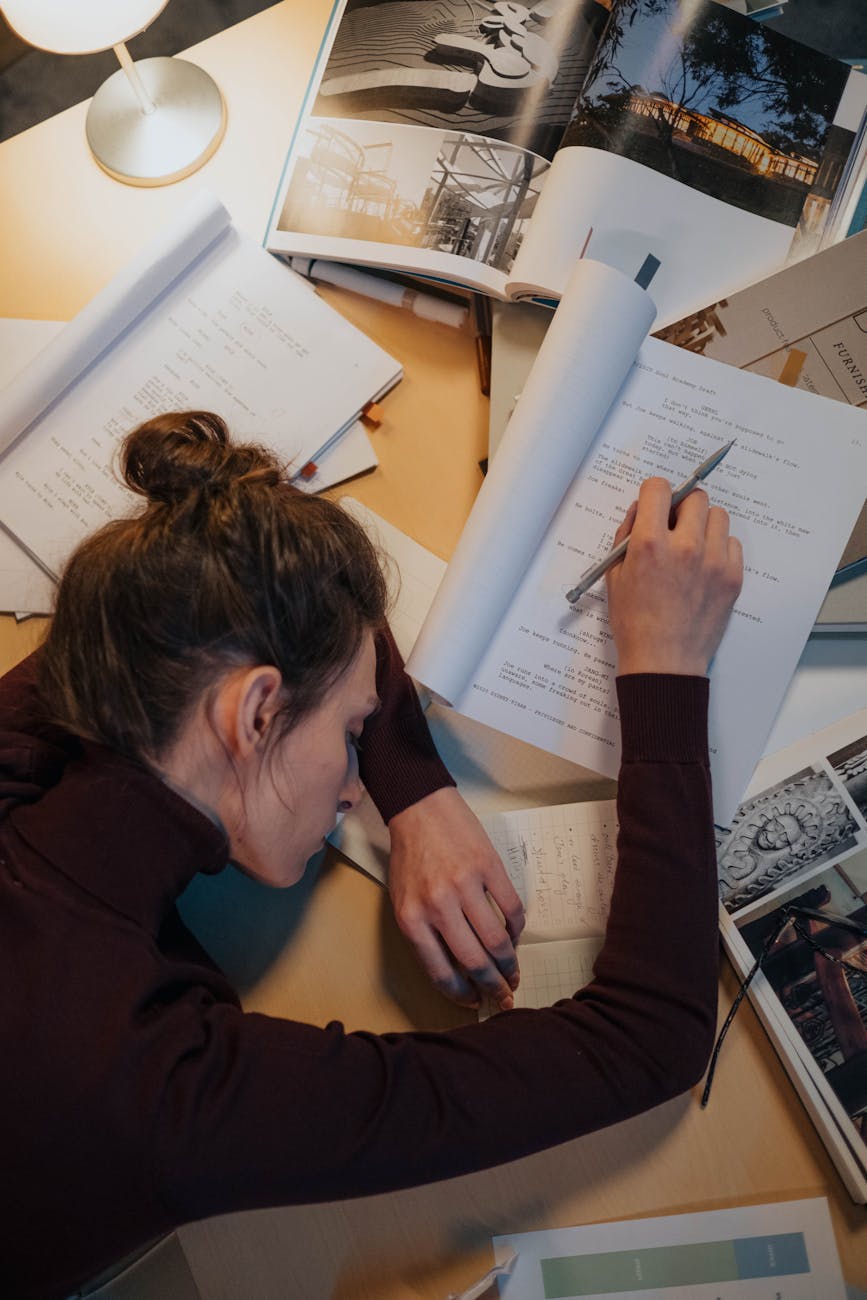 woman sleeping on papers at desk in work The Hidden Struggle of High-Achieving Women: Mental Burnout