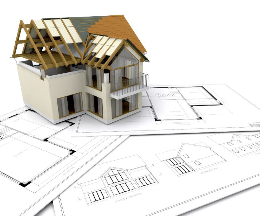 A 3D model of a house under construction sits atop architectural blueprints, showcasing the design structure and layout for a new home.Is Building Your Own Home the Ultimate Dream or a Costly Mistake?