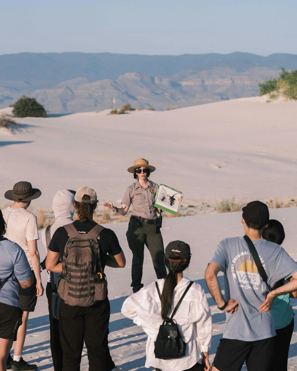 tourists with a tour guide 6 Careers That Let You Travel and Work At The Same Time