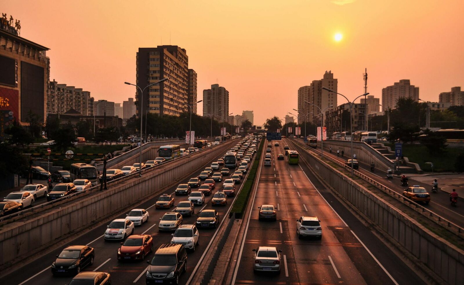 vehicle in road at golden hour Sustainability Mindset: 7 Ethical Ways to Cut Carbon on Your Commute