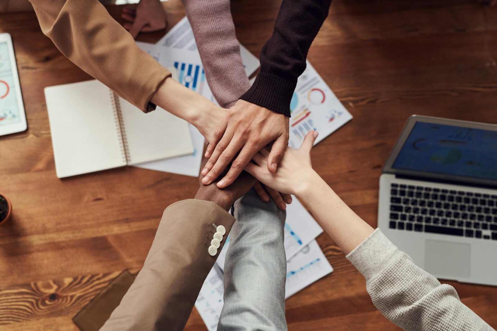 photo of people near wooden table Why Successful Businesses Break Down Plus 6 Ways to Prevent It