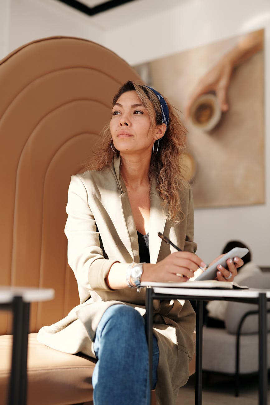 woman wearing blazer and blue denim jeans sitting on chair Why Successful Businesses Break Down Plus 6 Ways to Prevent It