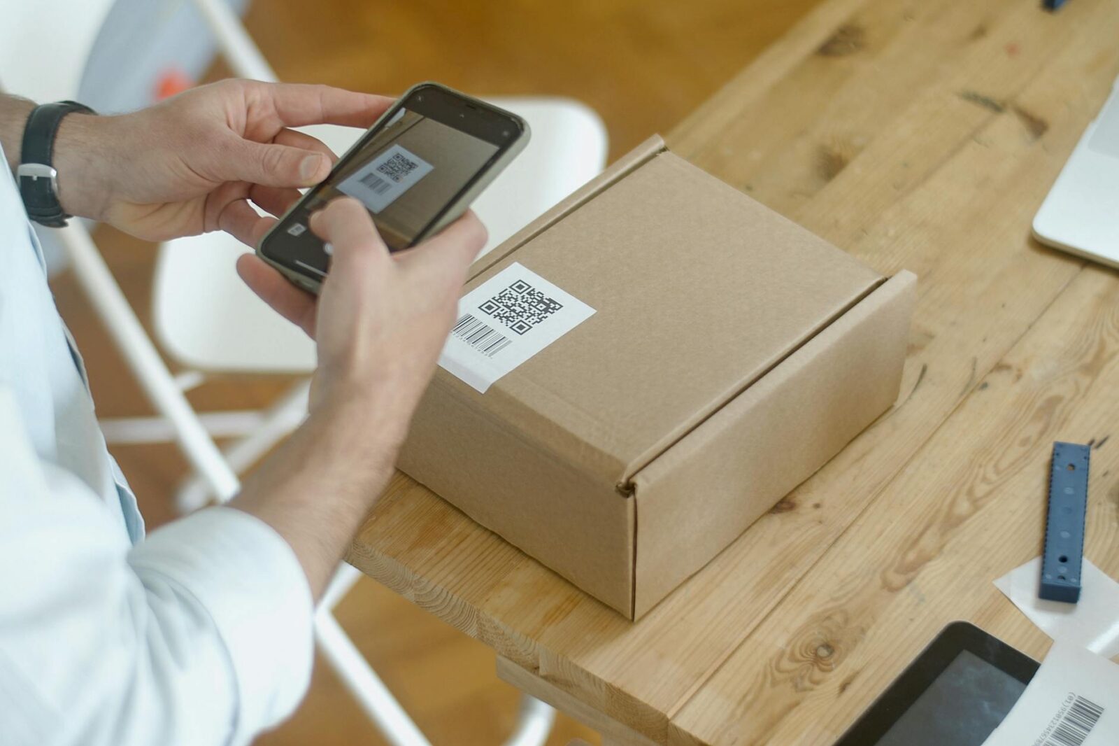 person taking photo of the qr code The Sanity-Saving Guide for Online Store Owners