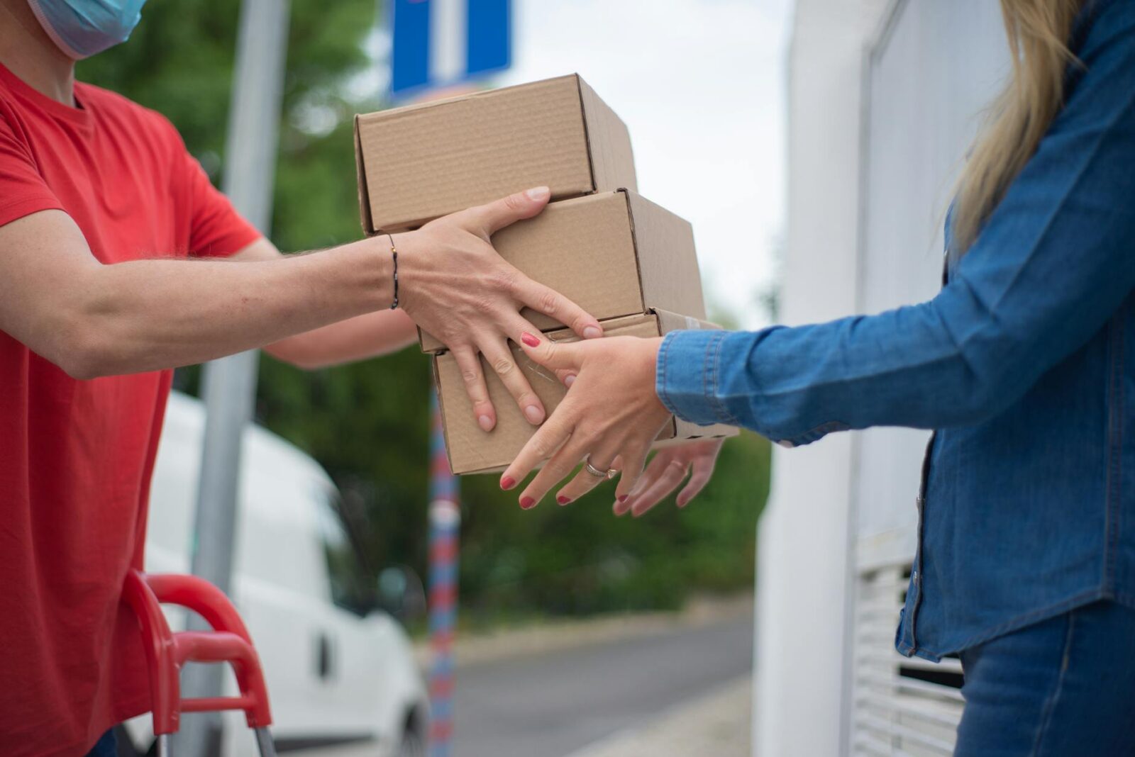 a person receiving a boxes Building a Sustainable Supply Chain: Lessons from the Industrial Sector