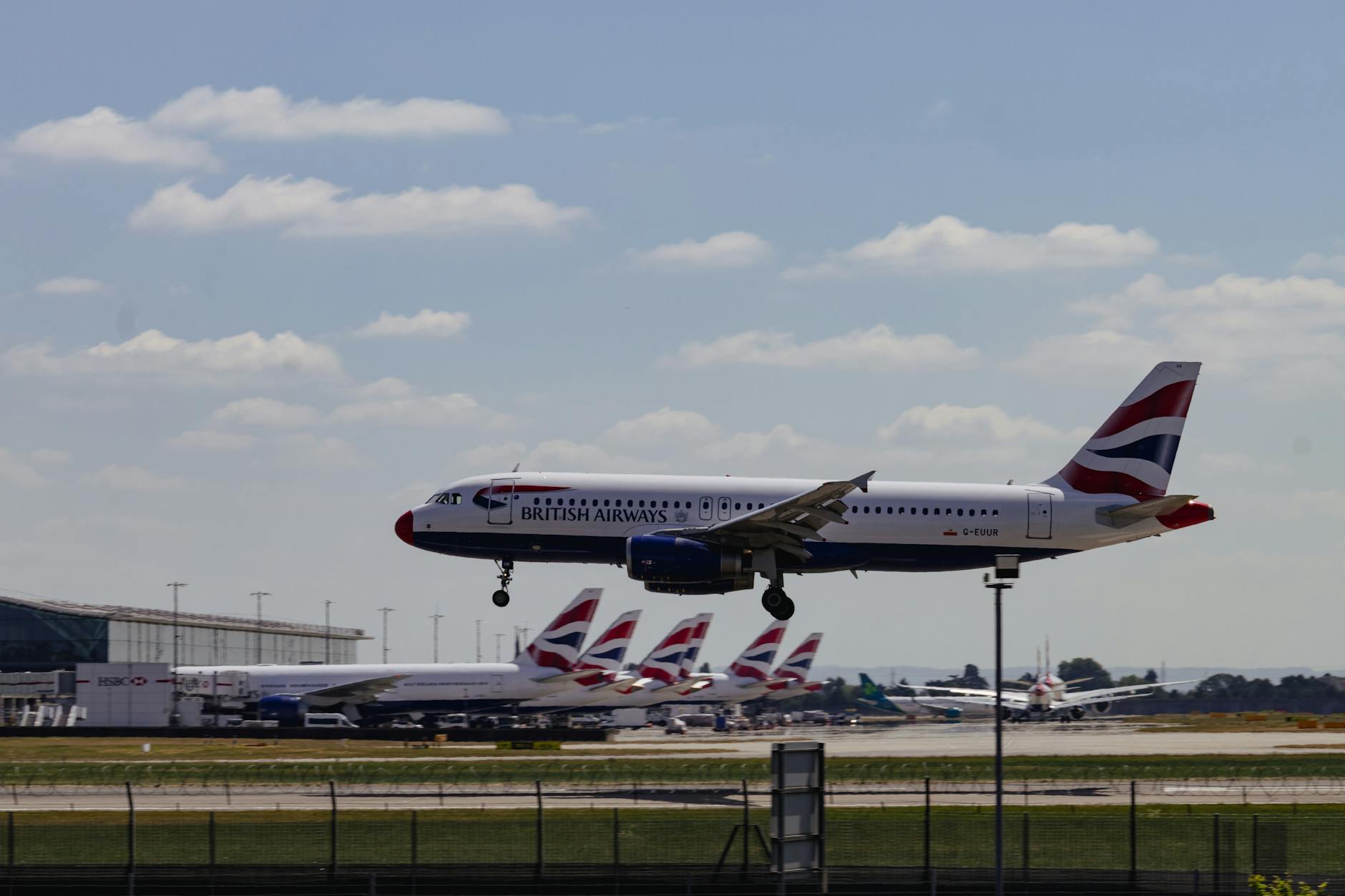 british airways plane landing at heathrow airport Best Airlines to Fly Business Class to the UK from the USA (2026 Guide)